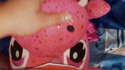 Perverted fellow is rubbing his hard willy on a cute pinky toy