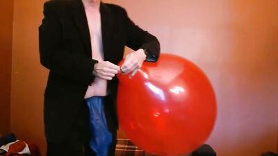 Perverted grandpa is playing with huge balloon in front of the cam