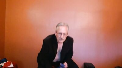 Perverted grandpa is playing with huge balloon in front of the cam