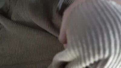 Close-up video of chap stroking his prick with a condom on