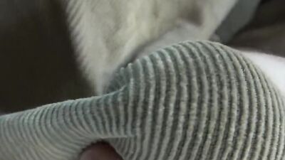 Close-up video of chap stroking his prick with a condom on