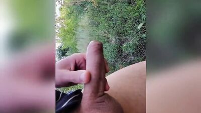 Amateur gay dude is stretching his big dick out in the open