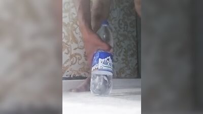 Perverted gay chap is riding a bottle in front of the cam