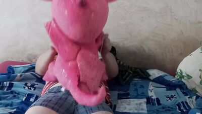 Naughty amateur chap is rubbing his pecker on a cute pinky dinosaur