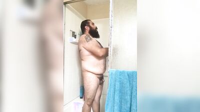Amateur bear is filming himself while taking a hot shower