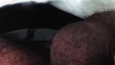 Close-up footage of a chap playing with his pecker