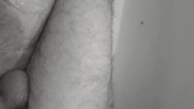 Amateur lad strokes his tiny pecker with a condom on