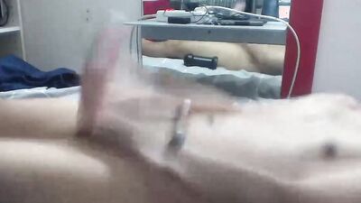 Horny gay teen is stroking his pecker with a rubber puss