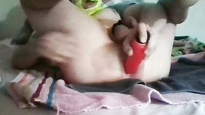 Perverted chap is stretching his hole with a plastic toy
