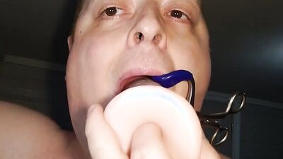 Chubby amateur bloke is wrapping his slimy mouth around huge dildo