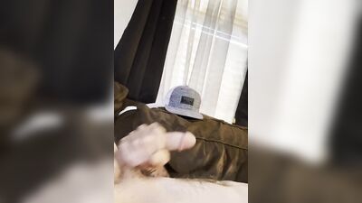Chap strokes his cock on the couch in this close-up video