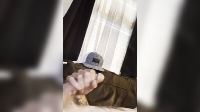 Chap strokes his cock on the couch in this close-up video