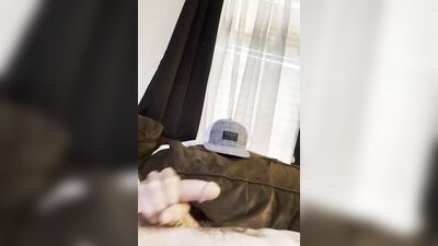 Chap strokes his cock on the couch in this close-up video