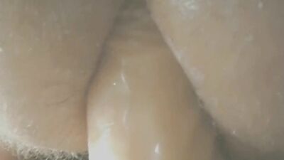 Round ass European fella is rising a dildo in front of the cam