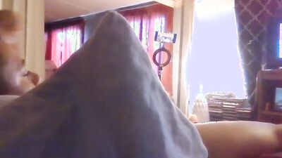 Amateur lad is rubbing his pecker on a bed while watching TV