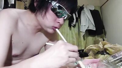 Amateur Japanese fellow is eating some food in front of the cam