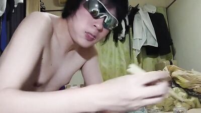 Amateur Japanese fellow is eating some food in front of the cam