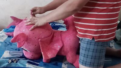 Perverted fellow is rubbing his pecker on a pinky dragon toy