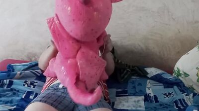 Perverted fellow is rubbing his pecker on a pinky dragon toy