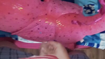 Lad rubs his hard wily on a cute pinky dinosaur