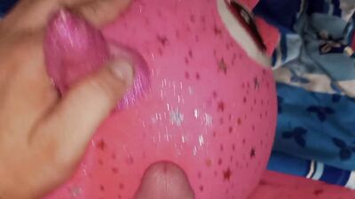 Lad rubs his hard wily on a cute pinky dinosaur