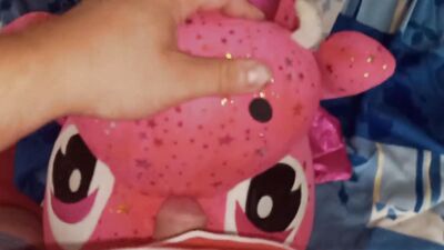 Lad rubs his hard wily on a cute pinky dinosaur