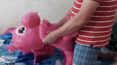 Lad rubs his hard wily on a cute pinky dinosaur