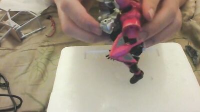 Amateur Japanese bloke is playing with his toys in front of the cam