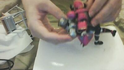 Amateur Japanese bloke is playing with his toys in front of the cam