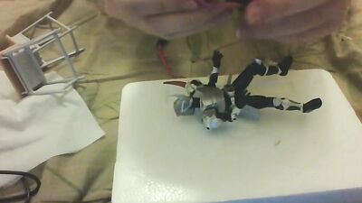Amateur Japanese bloke is playing with his toys in front of the cam