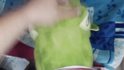 Perverted bloke is rubbing his pecker on a green toy