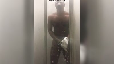 Horny African dude is playing with his BBC inside the hot shower