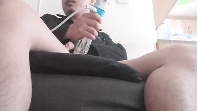 Perverted Asian chap is teasing his pecker with an electrical toy