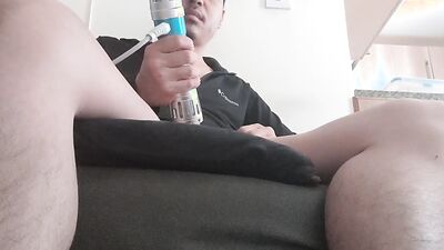 Perverted Asian chap is teasing his pecker with an electrical toy
