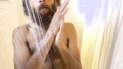 Hairy Rock Mercury is taking a shower in front of the camera