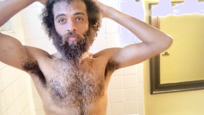 Hairy Rock Mercury is taking a shower in front of the camera