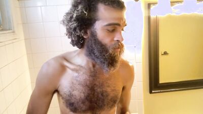 Hairy Rock Mercury is taking a shower in front of the camera