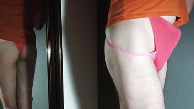 Perverted femboy plays with a cock in front of the mirror