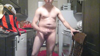 Perverted amateur bloke is playing with a cock in the kitchen
