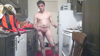 Perverted amateur bloke is playing with a cock in the kitchen