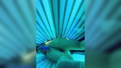 Horny bloke is jerking his cock inside the tanning salon
