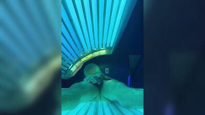 Horny bloke is jerking his cock inside the tanning salon