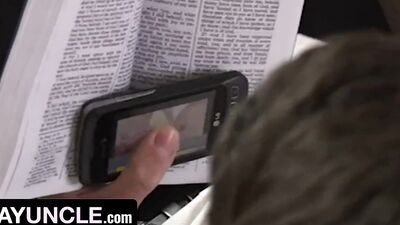 Perverted lad is jerking his prick while reading a book