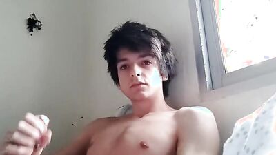 Good looking teen jerks his prick in front of the cam