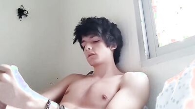 Good looking teen jerks his prick in front of the cam