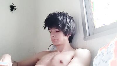 Good looking teen jerks his prick in front of the cam