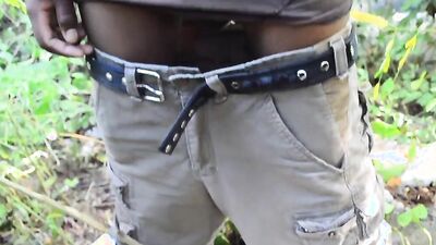 Horny African lad strokes his BBC deep inside the forest