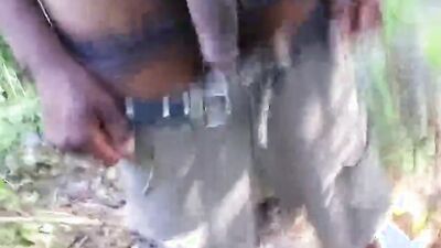 Horny African lad strokes his BBC deep inside the forest
