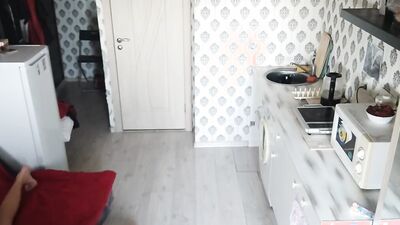 Skinny chap is playing with his gummy toy inside the kitchen