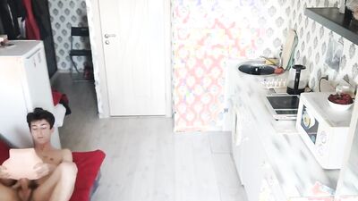 Skinny chap is playing with his gummy toy inside the kitchen